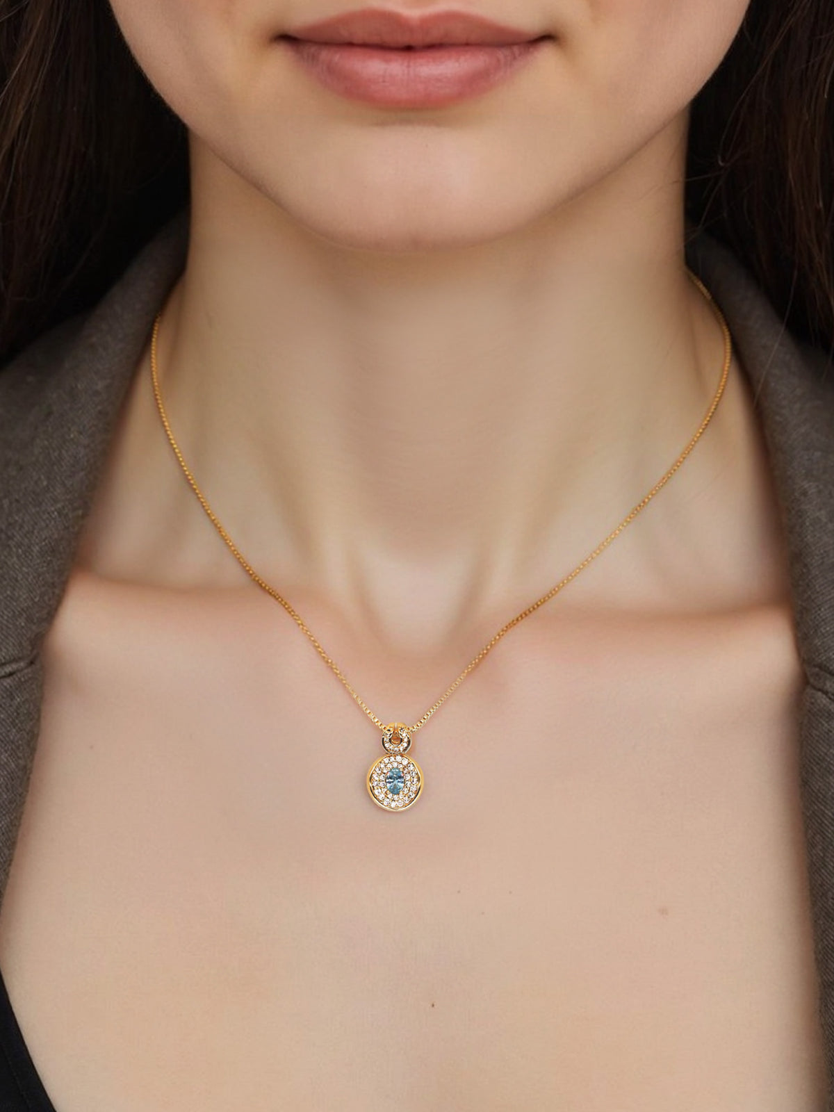 Bright Free Sky Necklace in gold, shown on a model, front close-up