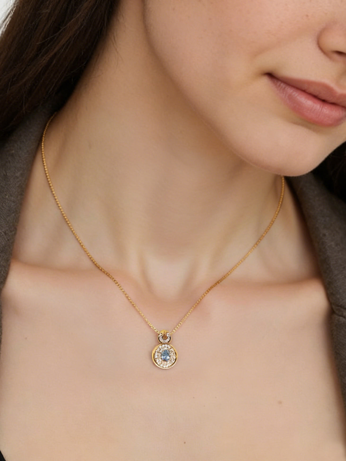 Bright Free Sky Necklace in gold, shown on a model, three-quarter close-up