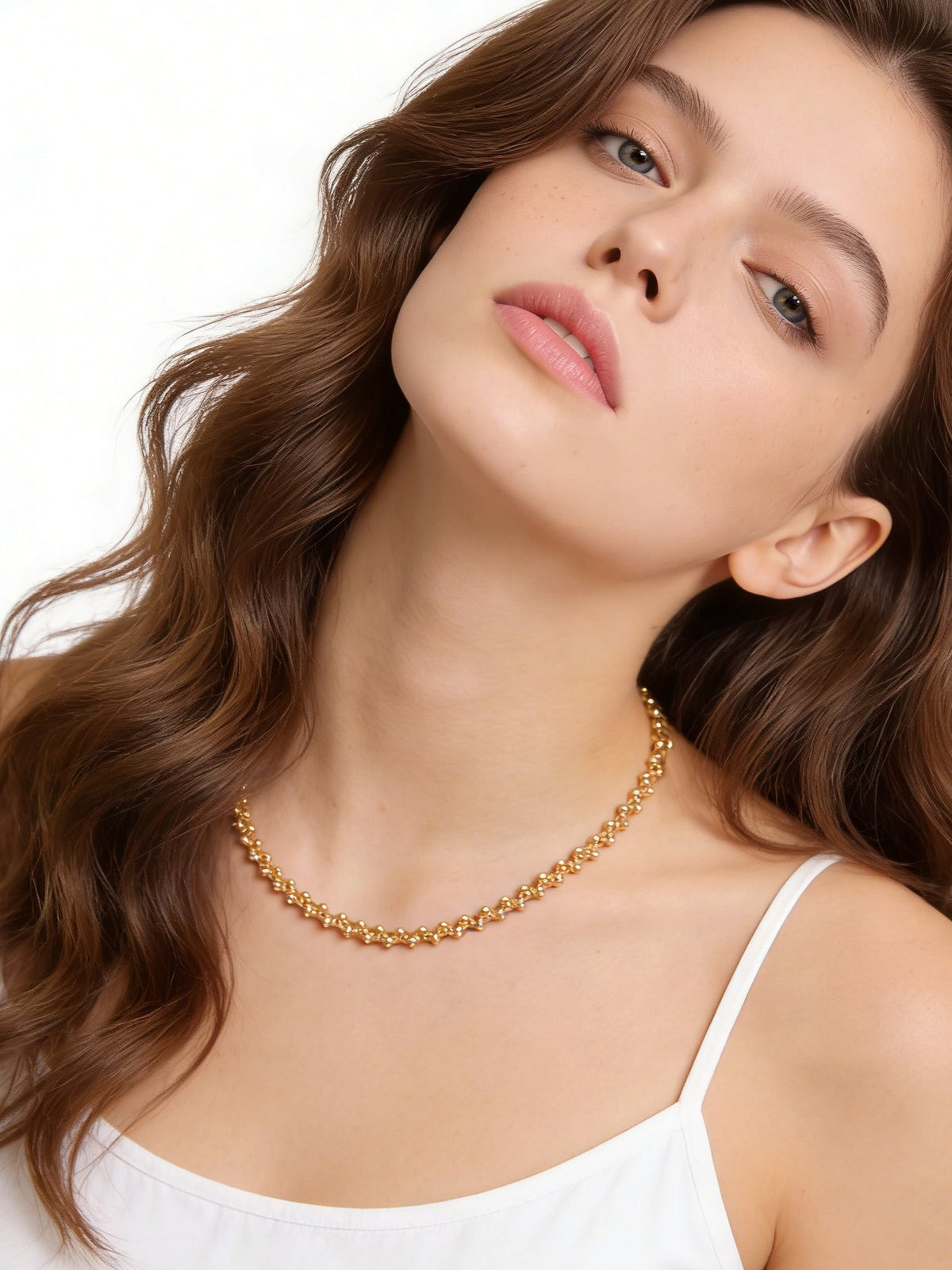 Golden Beaded Choker Necklace in gold, shown on a model leaning back