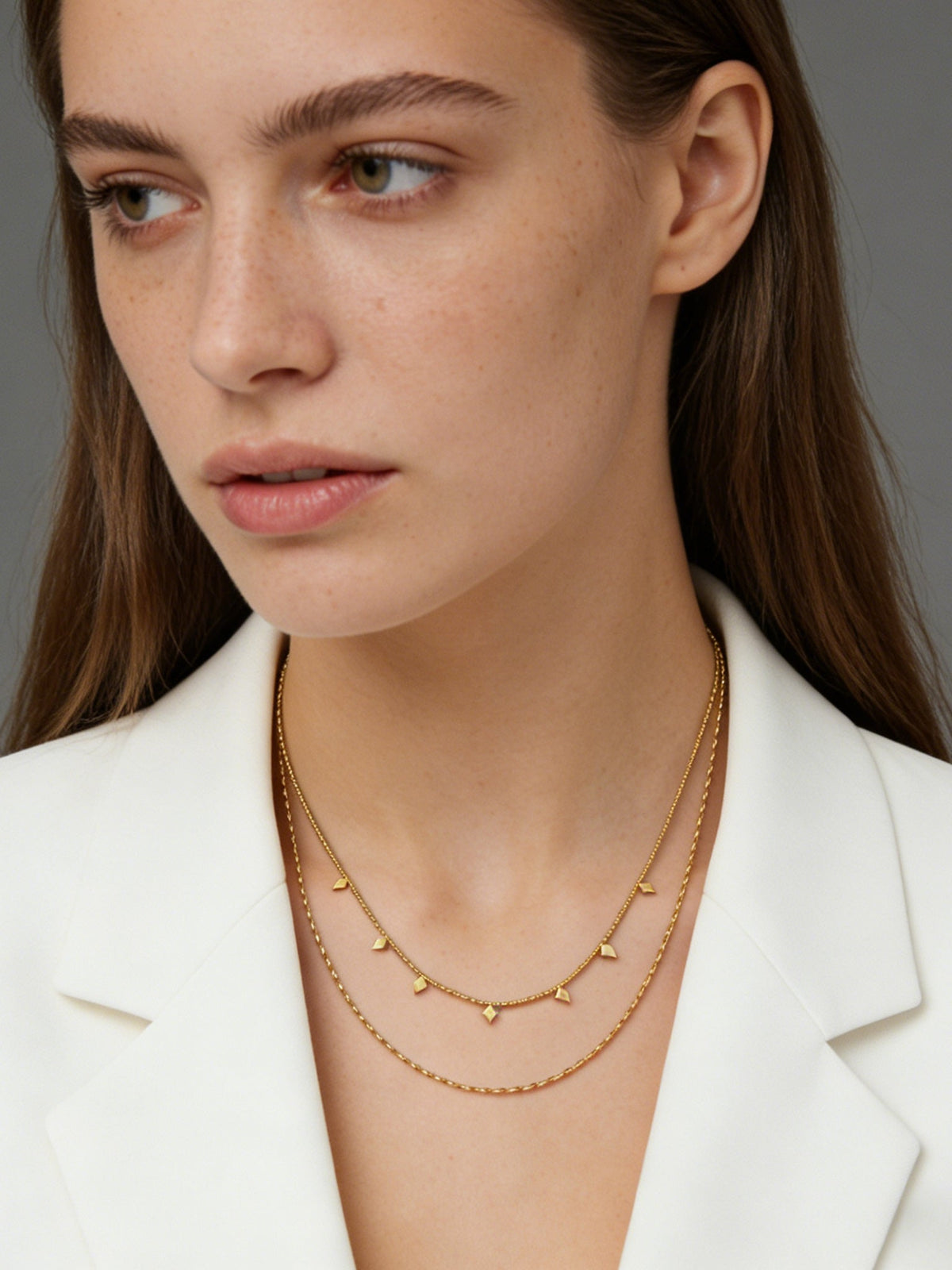 Layered Geo Pendant Necklace in gold, shown on a model, close-up front view