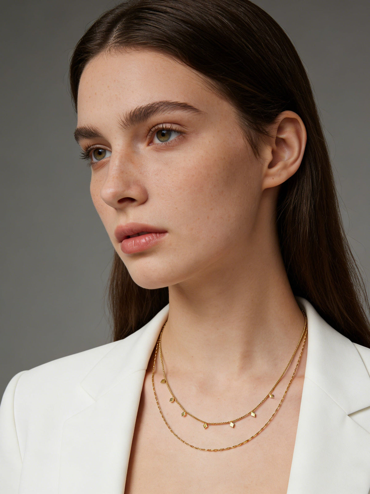 Layered Geo Pendant Necklace in gold, shown on a model, front view