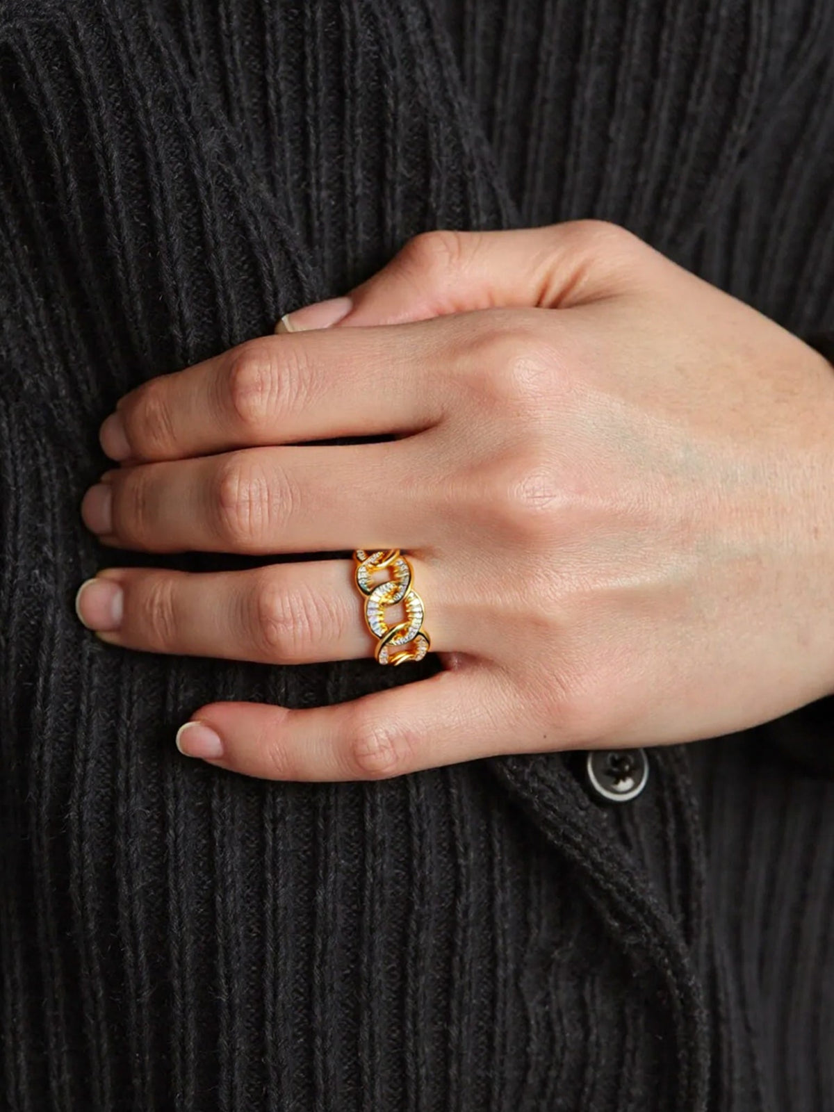Self-Connection Chain Ring in gold with clear stones, shown on a model, close up