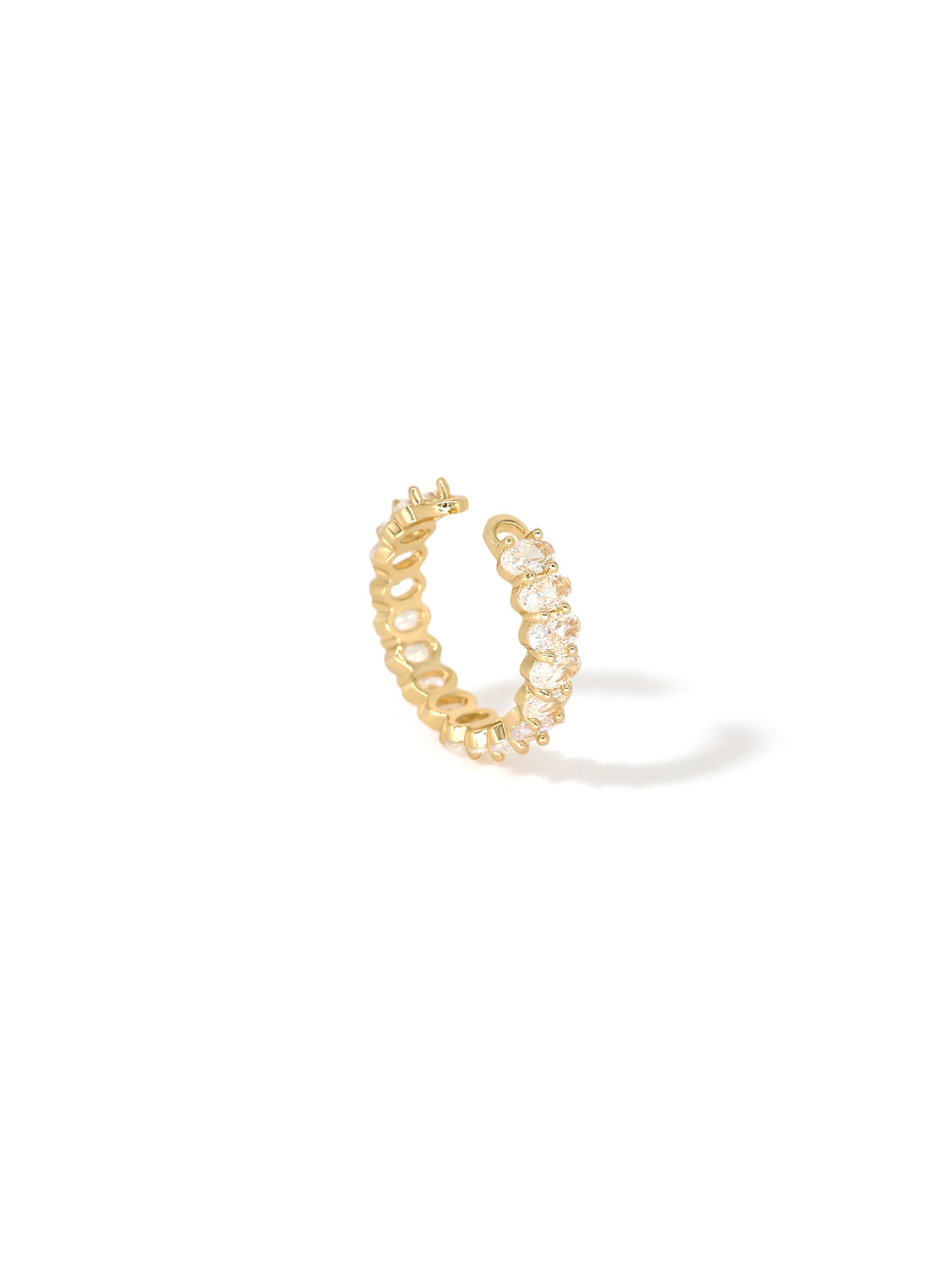 The Luminous Embrace Oval Eternity Ring in gold with clear stones, on a white background, profile view