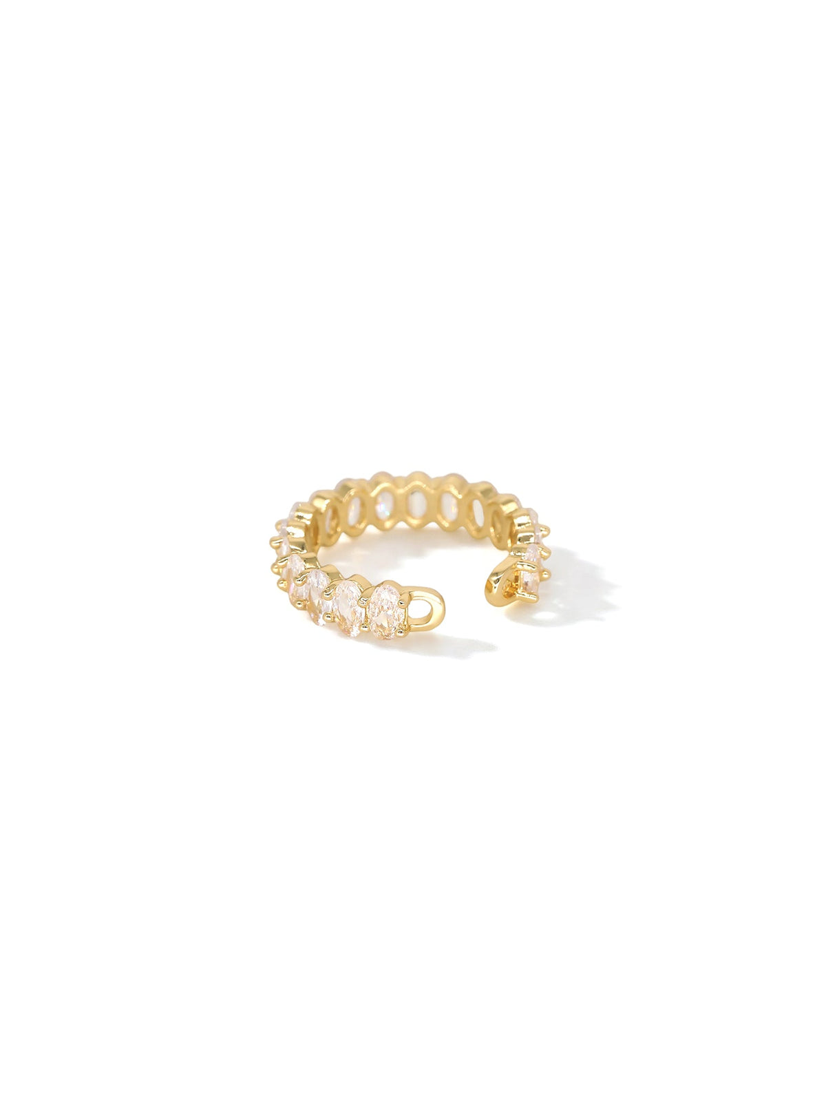 The Luminous Embrace Oval Eternity Ring in gold with clear stones, on a white background, profile view