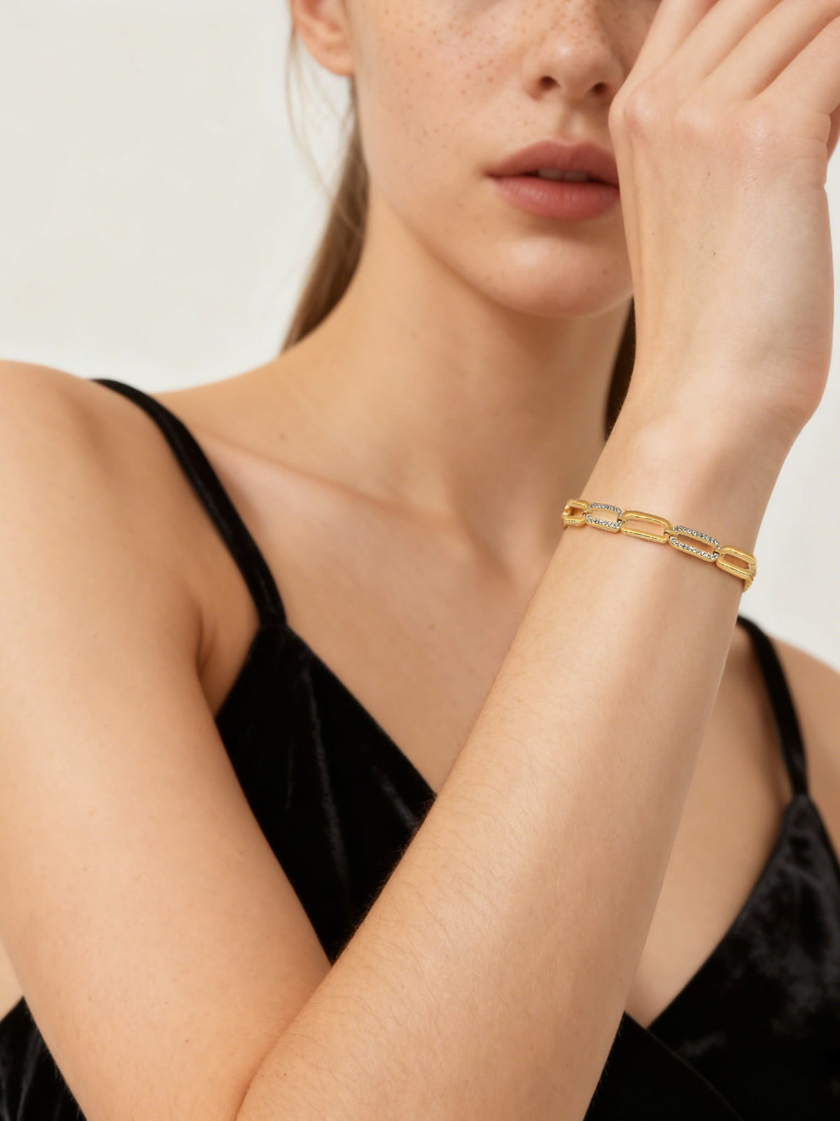 Wrist Sparkle Zircon Link Bracelet in gold with clear zircons, shown on a model, three-quarter view